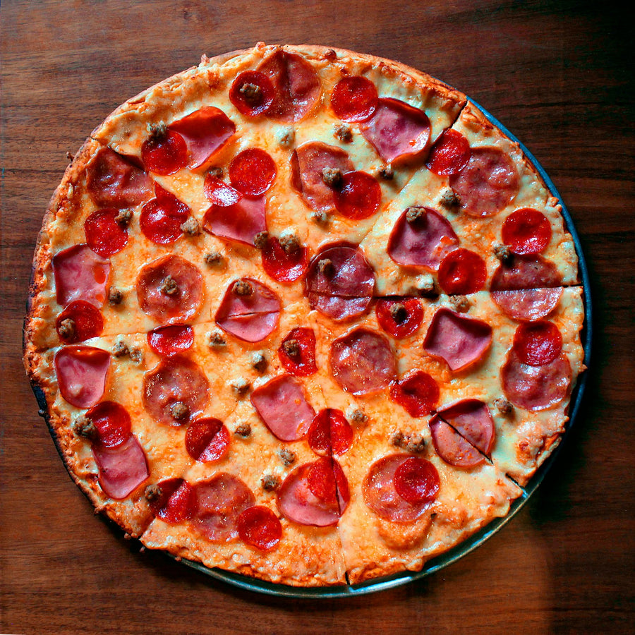 Pepperoni pizza on a wooden board